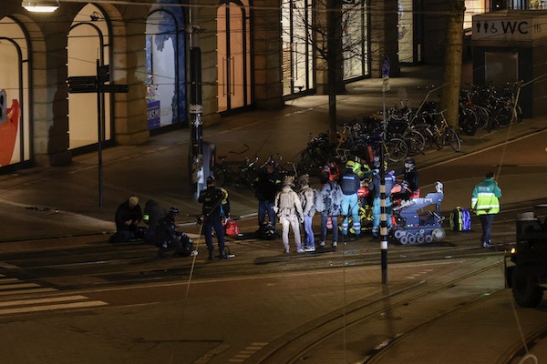 Ambulance workers placing the gunman on a stretcher